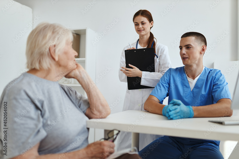 elderly woman in the doctor's office and nurse service communication