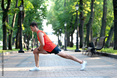 Get warmed up before workout. Man take warmup. Sportsman hold lunge position. Warmup exercises