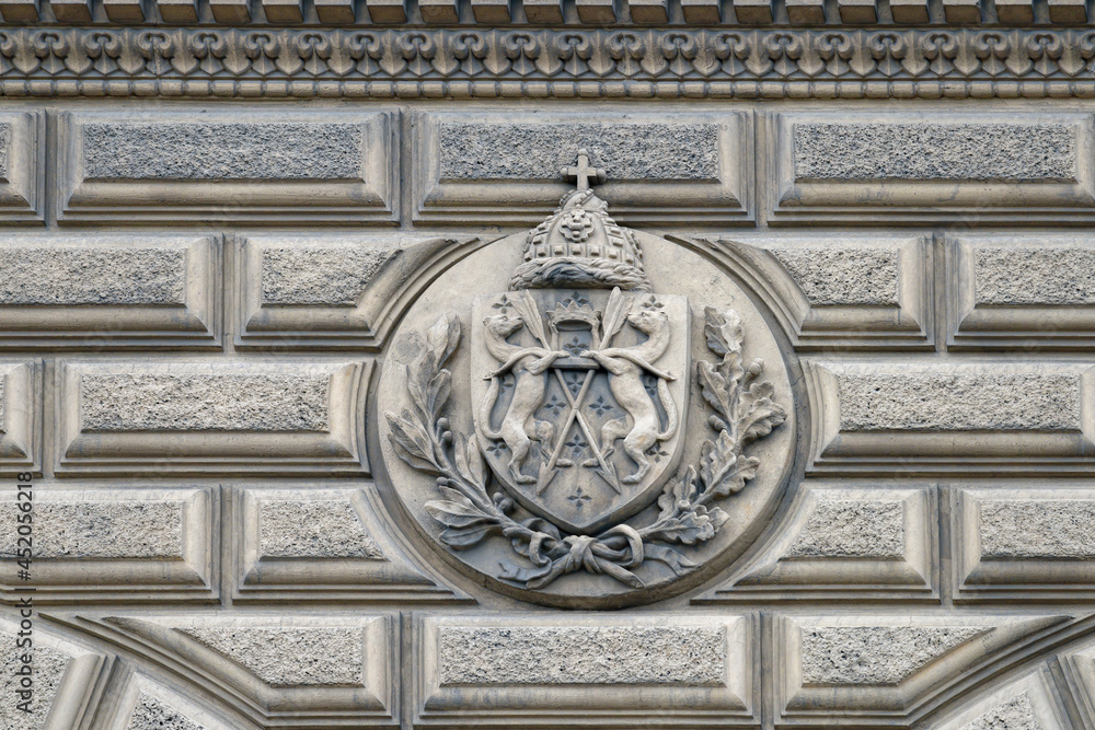 Coat of arms on the facade of Vladimir Palace (Vladimirsky dvorets), richly ornamented with stucco rustication, on Palace Embankment, SPb., Russia