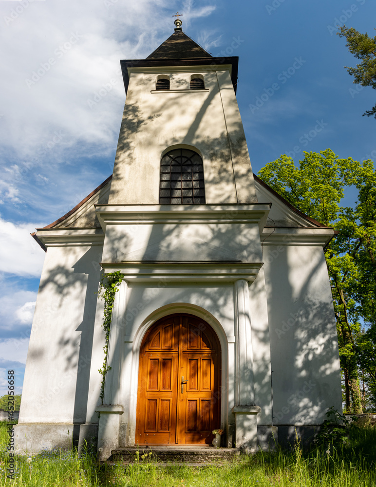 Naklejka premium Chapel in the cemetery at countryside
