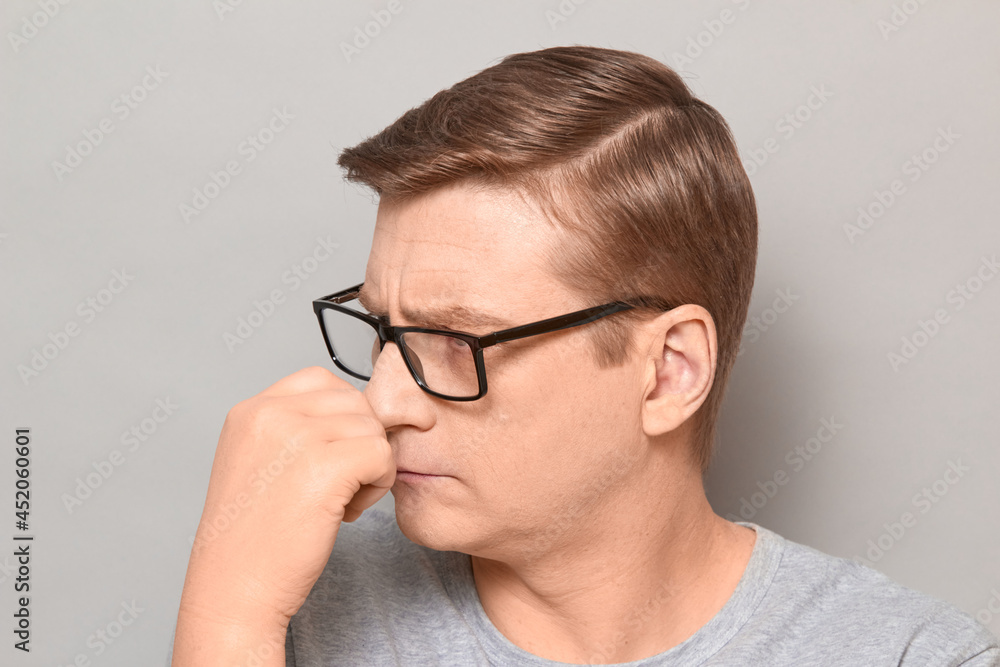 Portrait of serious thoughtful blond mature man with glasses Portrait of serious thoughtful blond mature man with glasses