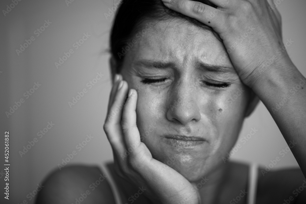 A businesswoman with a headache holding head A businesswoman with a headache holding head