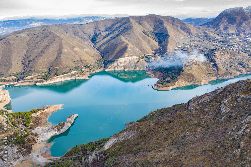 Aerial landscape shot of Reservoir of Chanels in Sierra Nevada mountains Granada, Andalucia, Spain