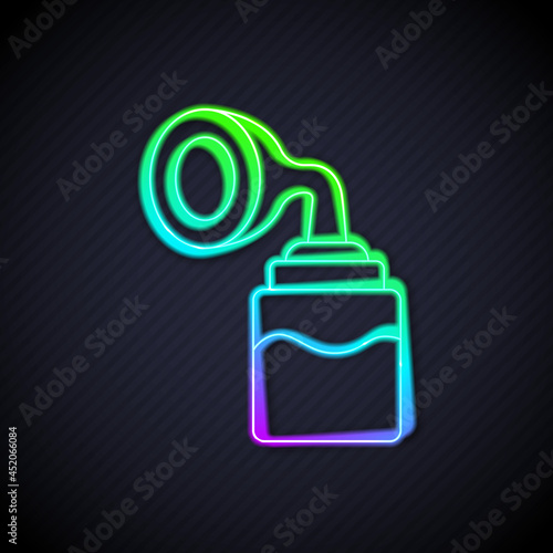 Glowing neon line Breast pump icon isolated on black background. Vector