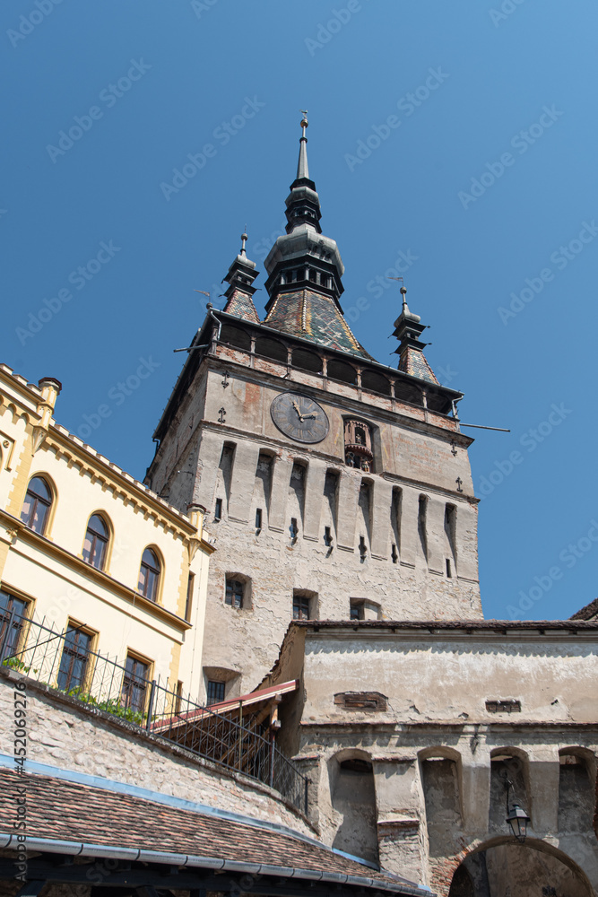 View of famous medieval fortified city and the Clock Tower, Sighisoara, Romania.