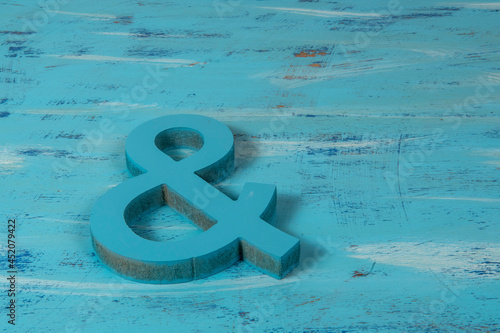 blue ampersand symbol on a background of the same color