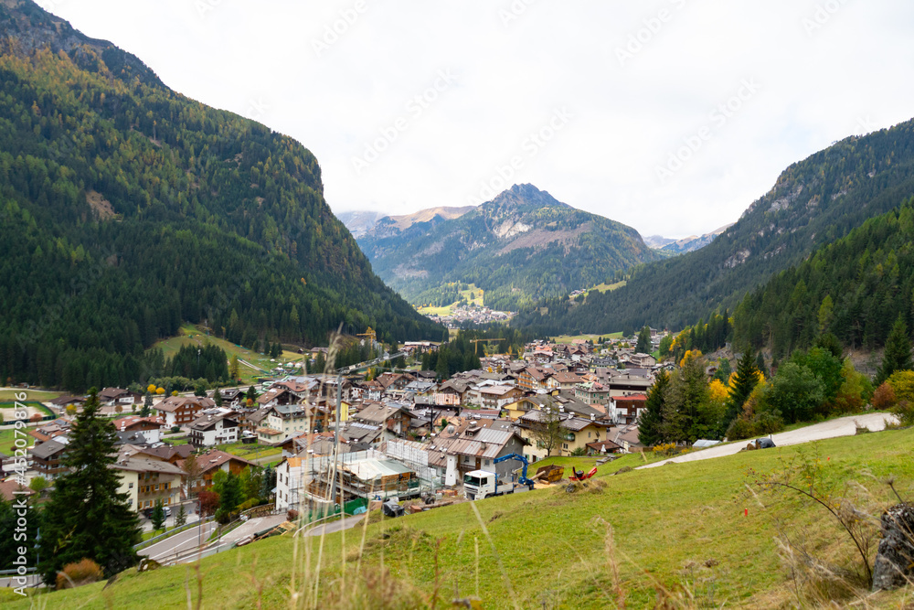 Houses in the valley around with mountain and  beautiful old city town with isolated white background at Dolomites,Italy.