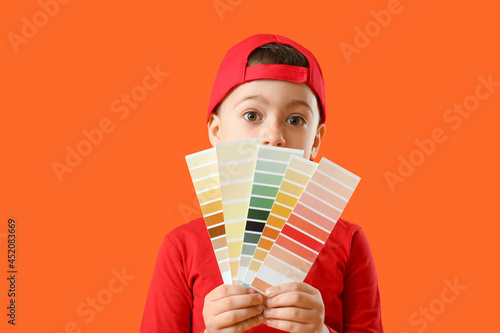 Little boy with paint sampl...