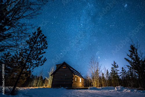 Starry night over a cabin in Whitehorse, Yukon, Canada photo