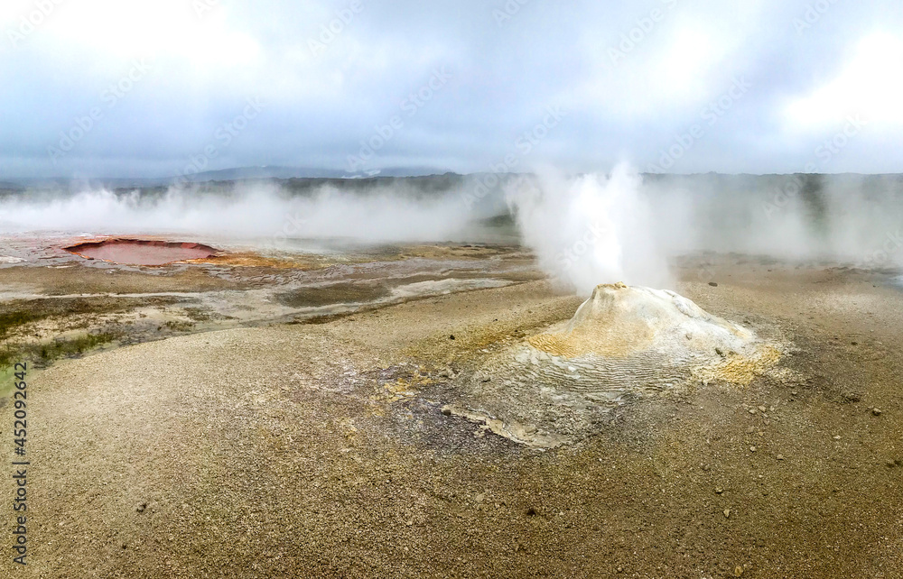 Geyser steams in the geothermal volcanic desert zone Hveravellir. Iceland Geyser steams in the geothermal volcanic desert zone Hveravellir. Iceland