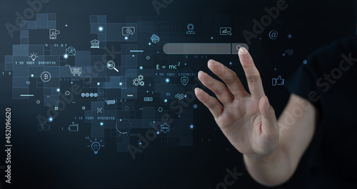 IoT, Internet of Things, digital marketing, business and technology concept. Woman hand touching on virtual screen with furture tech icons photo