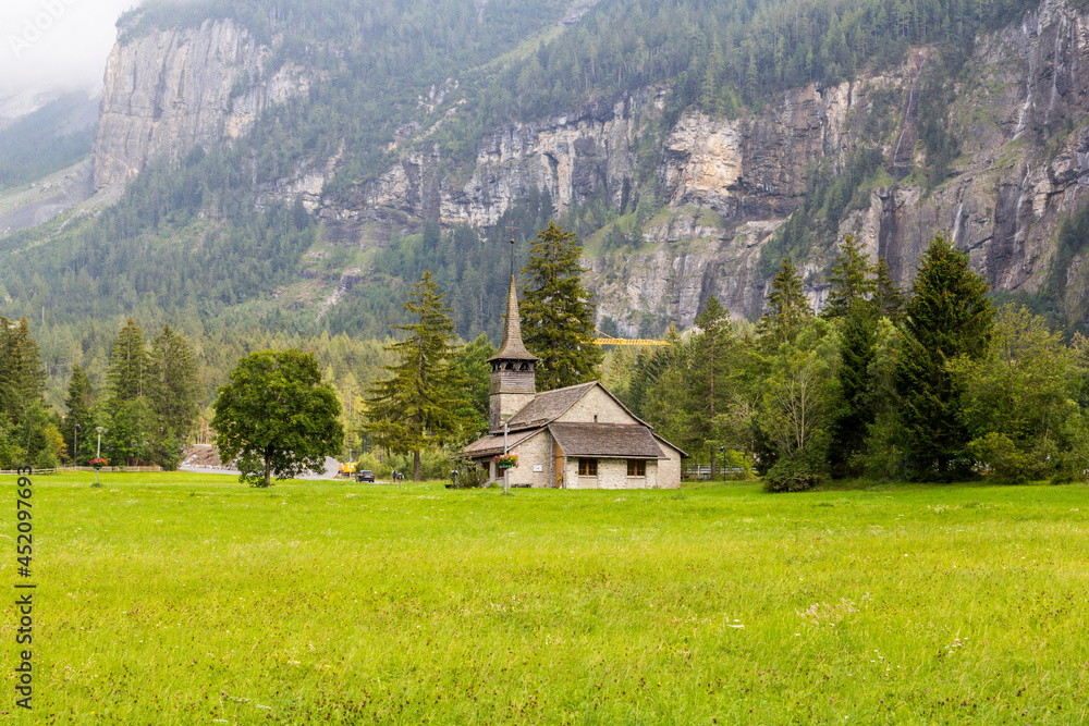 The Church of Our Lady (Marienkirche) with wood shingle roof on the sommer meadow of Kandersteg, Bern, Switzerland