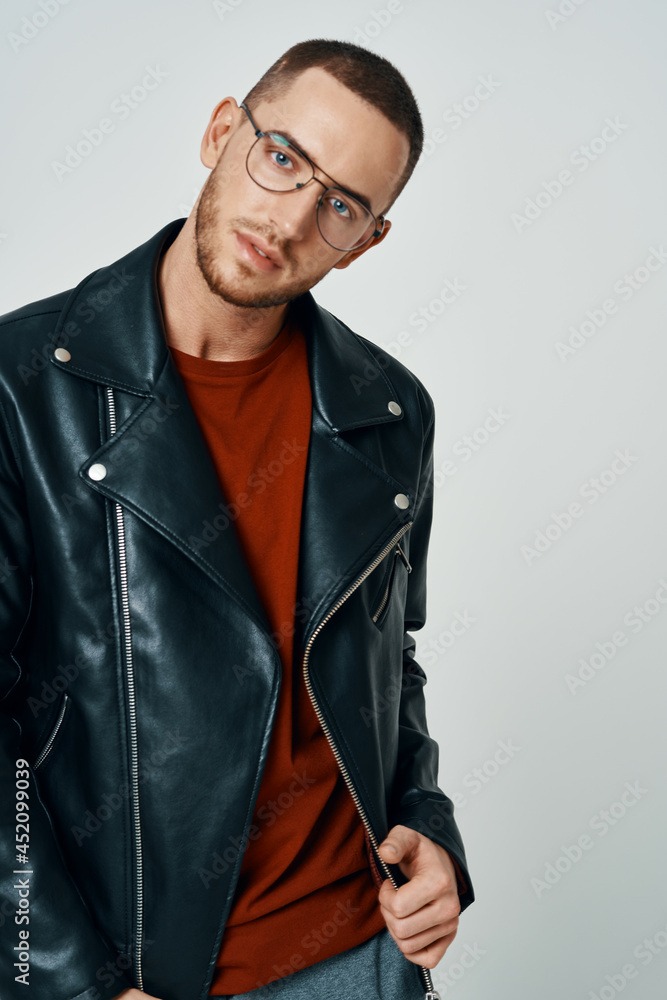 fashionable man in black leather jacket posing self confidence fashionable man in black leather jacket posing self confidence