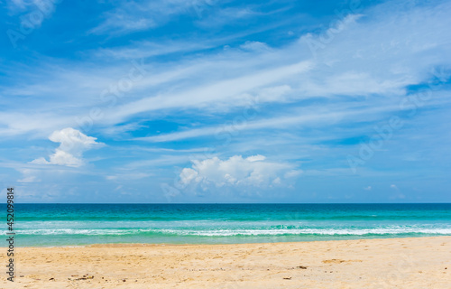 Landscape of sea beach sand and cloudy blue sky with sunny in nice weather day at Phuket sea Thailand.