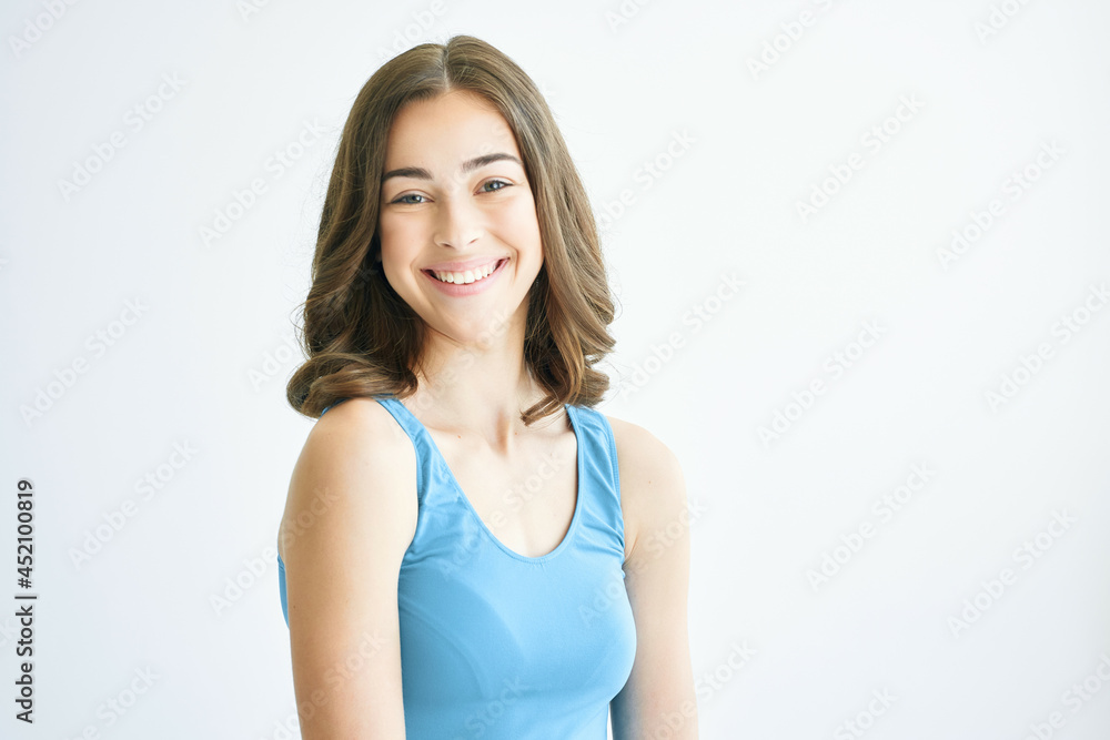 cheerful brunette fashion hairstyle blue tank top posing lifestyle fashion yes cheerful brunette fashion hairstyle blue tank top posing lifestyle fashion yes