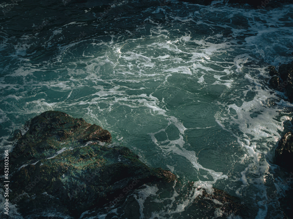 Fototapeta premium Tide wave on the rocky beach.
