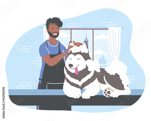 groomer bathing a dog