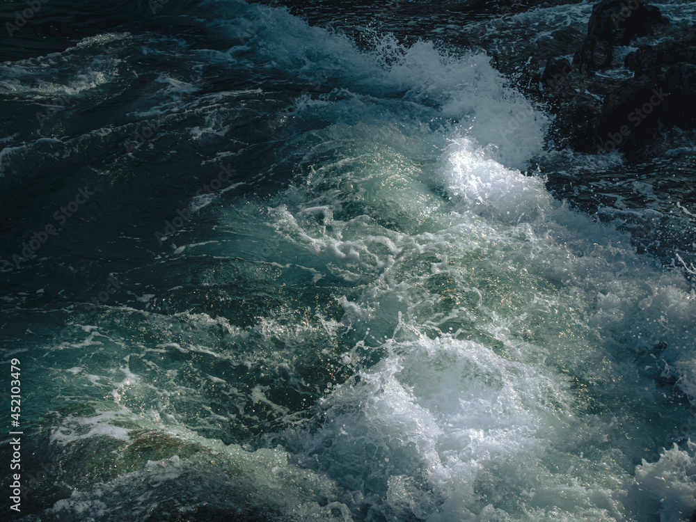 Fototapeta premium Tide wave on the rocky beach.