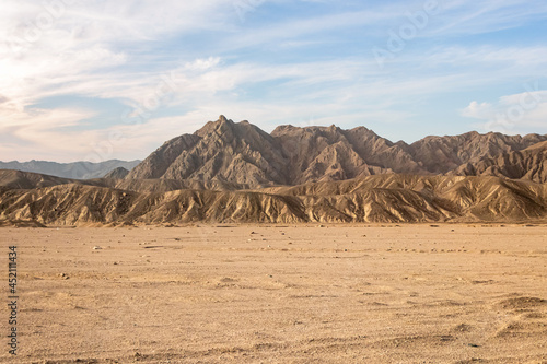 Hot desert with mountains with dramatic sky in Egypt, Africa