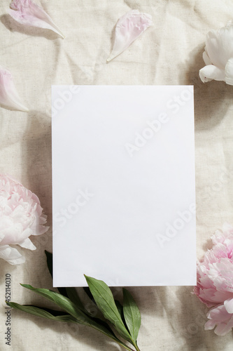 paper card note with pions on crumpled gray textile fabric. copy space. photo