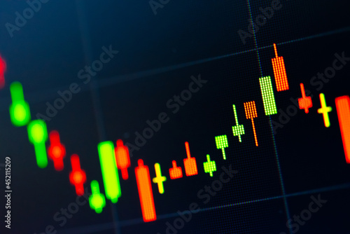 Abstract financial trading graphs and digital number of foreign exchange market trading on monitor. Background of gold and blue digital chart to represent stock market trend.	
 photo