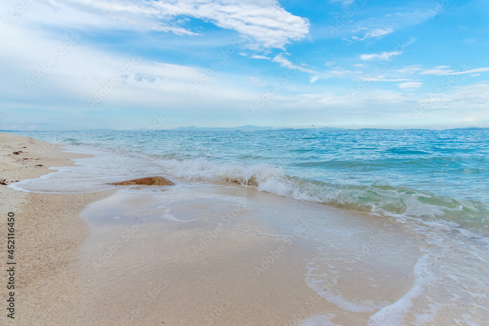 Nature in twilight period which including of sunrise over the sea and the nice beach. Summer beach with blue water and purple sky at the sunset.