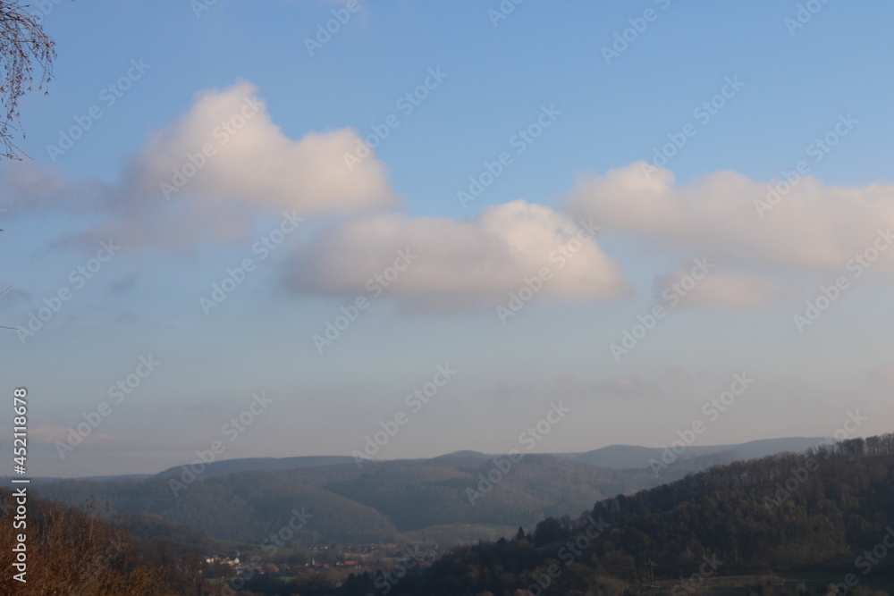 Large clouds over a natural landscape