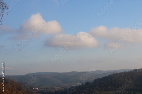 Large clouds over a natural landscape © Rico