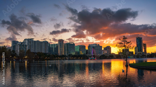 Colorful sunset above Lake Eola and city skyline in Orlando  Florida