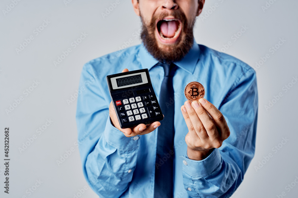 man with a calculator in his hands cryptocurrency electronic money finance manager man with a calculator in his hands cryptocurrency electronic money finance manager