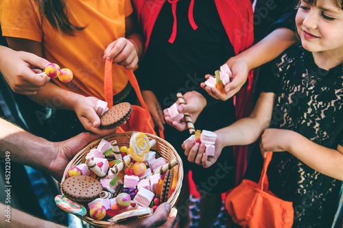 Фотография Children celebrate Halloween dressed up in costumes