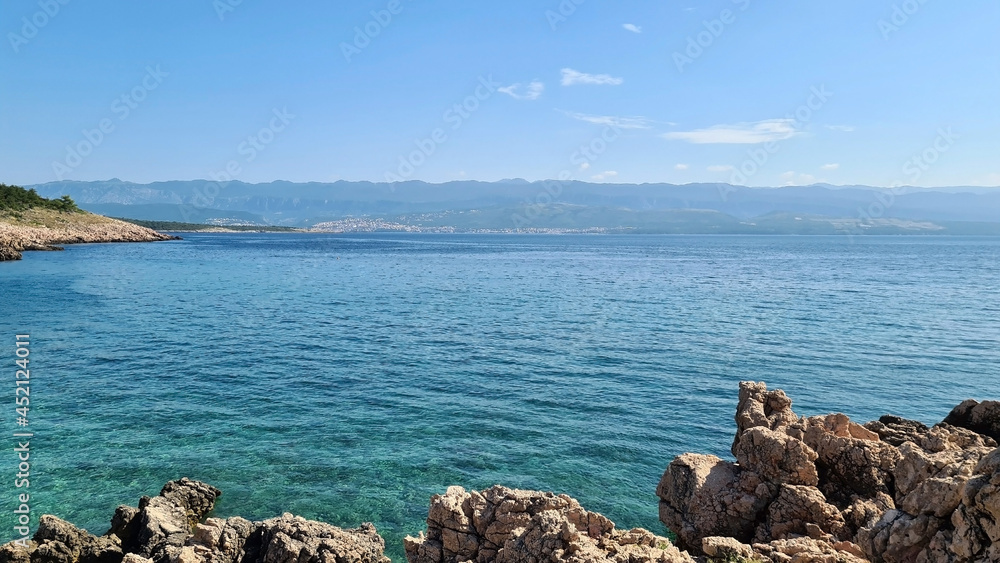 Sea, sky and rocky coast of the mediterranean sea on a sunny summer day