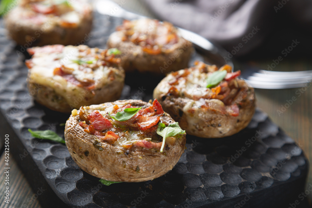 Baked mushrooms stuffed with cheese and bacon Baked mushrooms stuffed with cheese and bacon