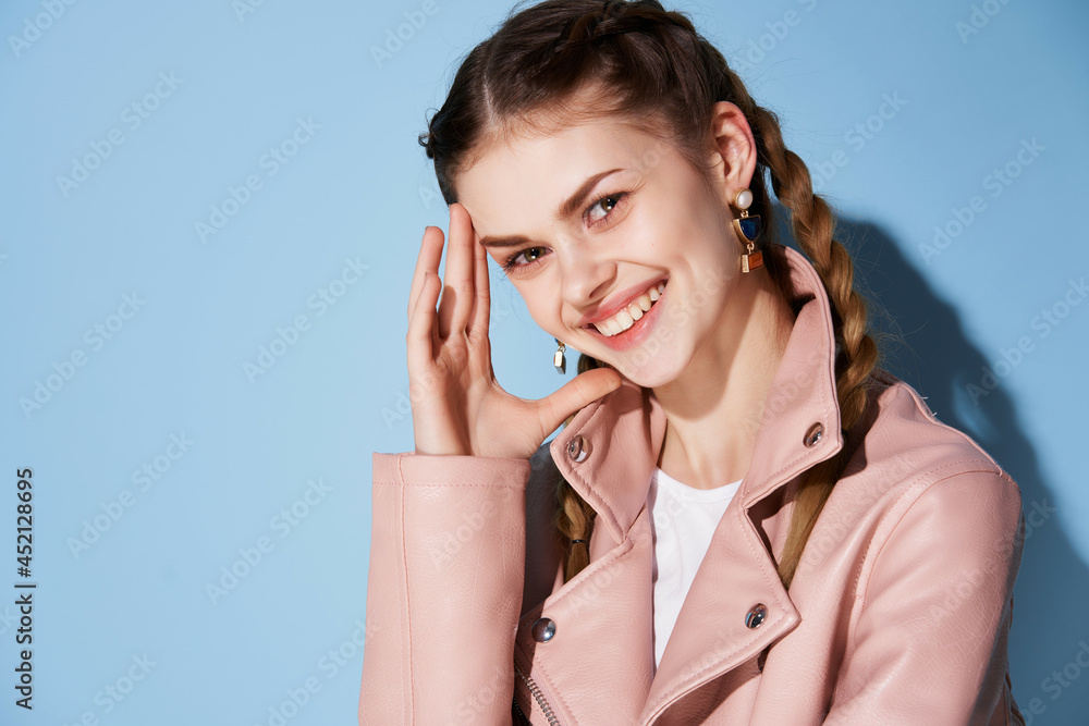 cheerful woman with pigtails in a pink jacket smile cosmetics posing cheerful woman with pigtails in a pink jacket smile cosmetics posing