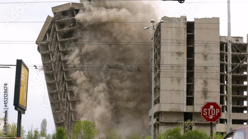 Old building demolition by controlled implosion using explosives. 4k.