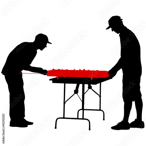 Silhouette two men playing table hockey on a white background