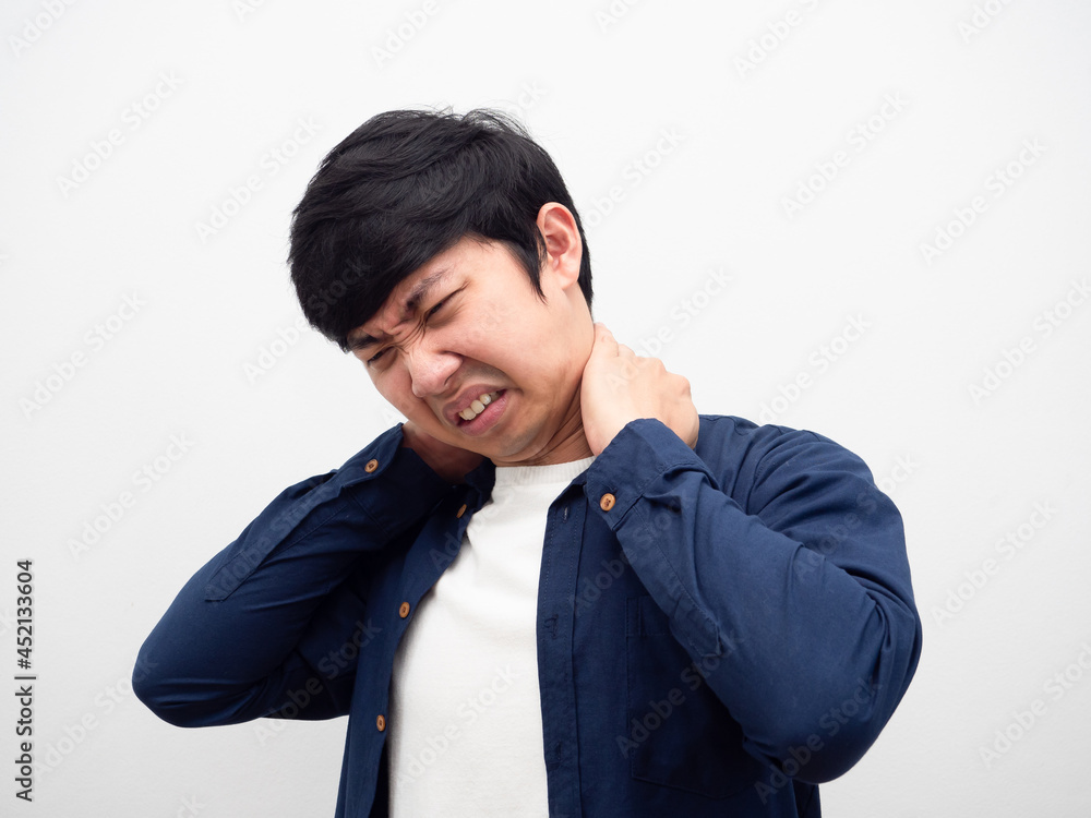 Man feeling pain his neck unhappy face portrait white background Man feeling pain his neck unhappy face portrait white background