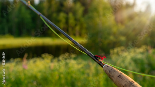 Fly fishing rod. Fishing on the mountain river. Summer Activities.