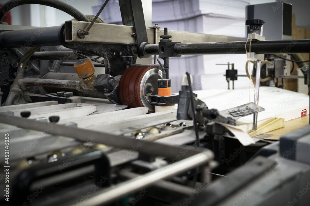 The offset press in the production process in the printing factory The offset press in the production process in the printing factory
