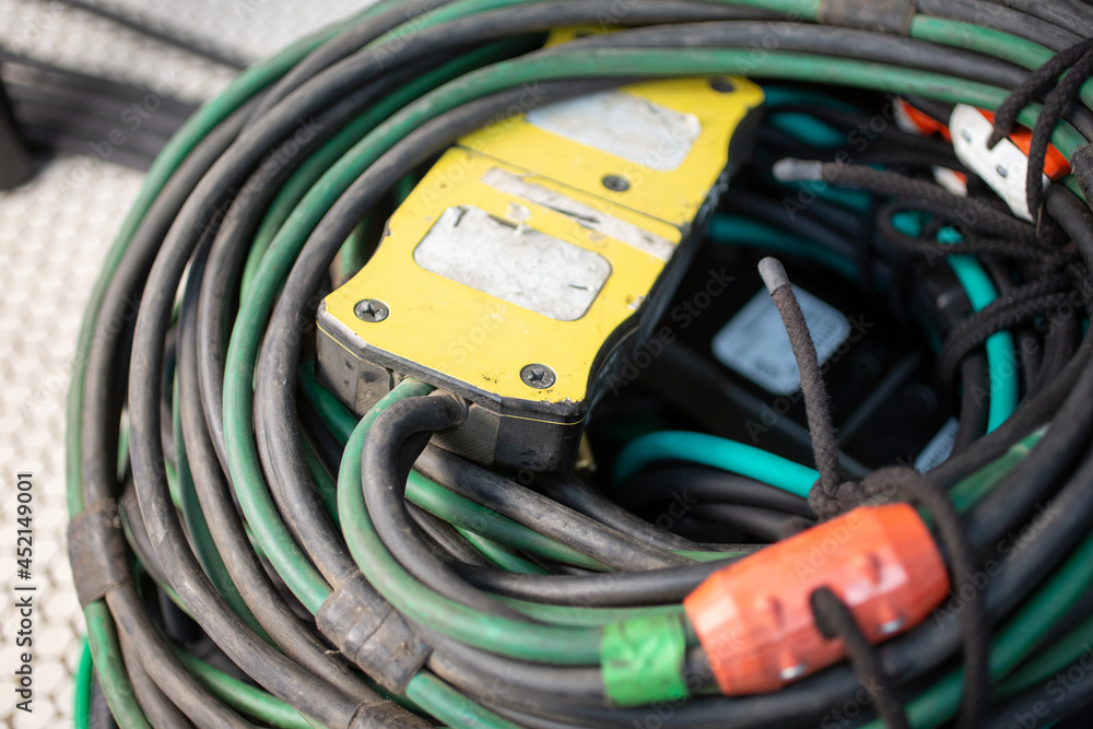 A view of a wrapped heavy-duty electrical lighting cable. A view of a wrapped heavy-duty electrical lighting cable.