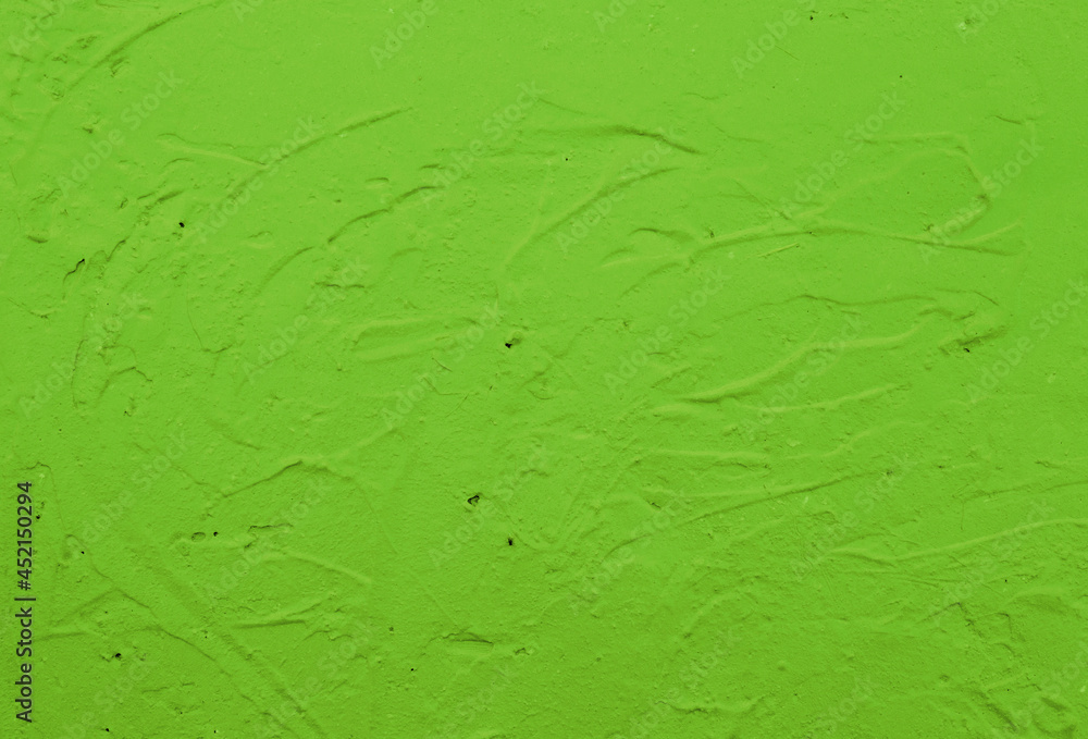 Picture of a wall painted with green paint. Picture of a wall painted with green paint.