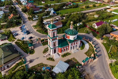 Aerial view of the Church of St. Nicholas the Wonderworker in the village of Rusinovo, the city of Ermolino, Kaluzhskiy region, Russia - August 2021 photo