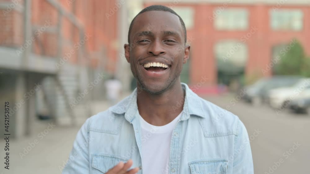 Outdoor Portrait of African Man Waving Hand, Hello Outdoor Portrait of African Man Waving Hand, Hello