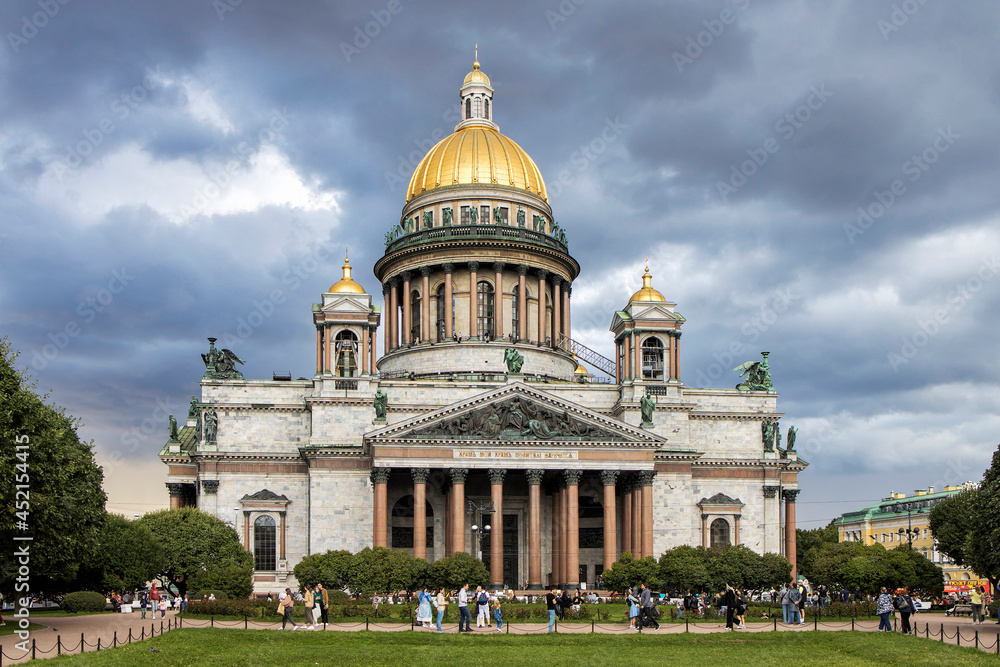 Saint Petersburg. Russia. St. Isaac's Cathedral on a Sunny summer day. Isaacy on the background of blooming lilacs. Business card of Petersburg. Cathedrals Of St. Petersburg. Summer trip to Russia.