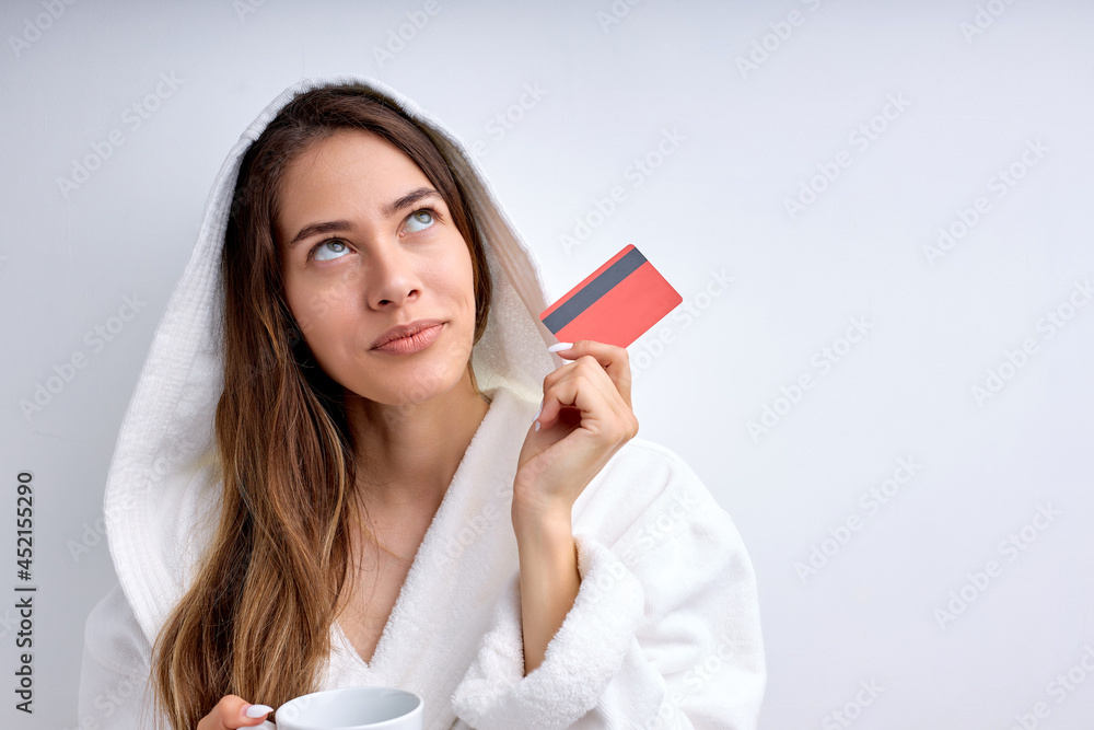 Dreamy Female In Bathrobe Stand In Contemplation Looking Up Thinking, Dreamy Lady In Contemplation. Excited Woman Want To Buy Smartphone Pay Credit Card, Online Shopping From Home At Weekends Dreamy Female In Bathrobe Stand In Contemplation Looking Up Thinking, Dreamy Lady In Contemplation. Excited Woman Want To Buy Smartphone Pay Credit Card, Online Shopping From Home At Weekends