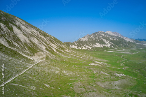 aerial view of the green plain of Campo Imperatore Abruzzo