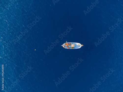 Aerial Drone photo of fisher boat in blue mediterranean sea from above, bird's eye view. Cyprus © og.videography