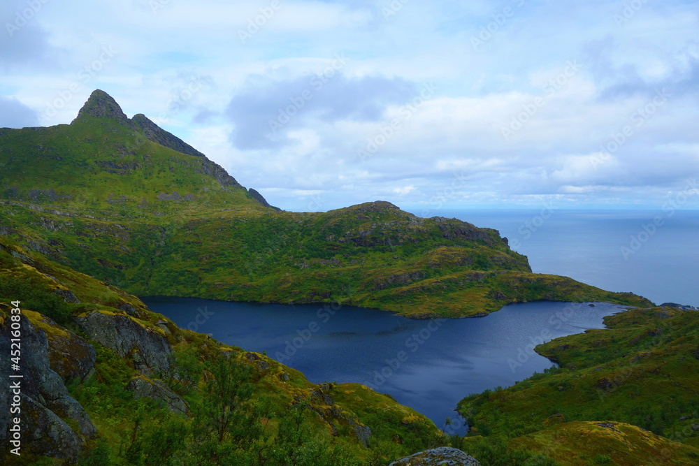 Obraz premium Munkebu hut hiking trail during arctic summer in mountains of Lofoten, Norway