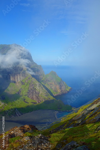 Helvetestinden mountain hike near to Bunes beach with a view of Bunesfjorden, Kjerkfjorden and Vindstad in Lofoten islands, Nordland photo