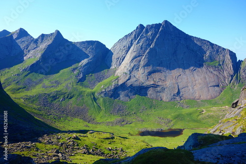 Dramatic mountain landscape on a hiking trail from Horseid beach to Kvalvika beach in Lofoten islands, Norway